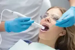 image of a woman receiving treatment at a dentist’s hospital