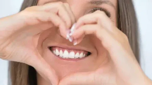 Image of a women that is showing her white teeth