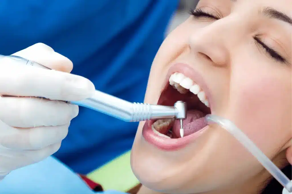 image of a woman receiving treatment at a dentist's hospital.