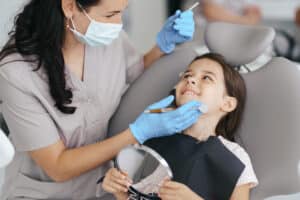 General & Family Dentistry 12 Little beautiful girl at the dentist smiling