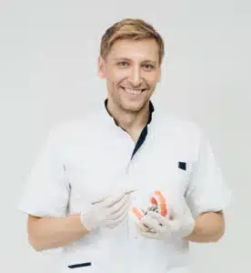 How Cavity Causing Bacteria can Attack the Heart 1 A happy smiling dentist