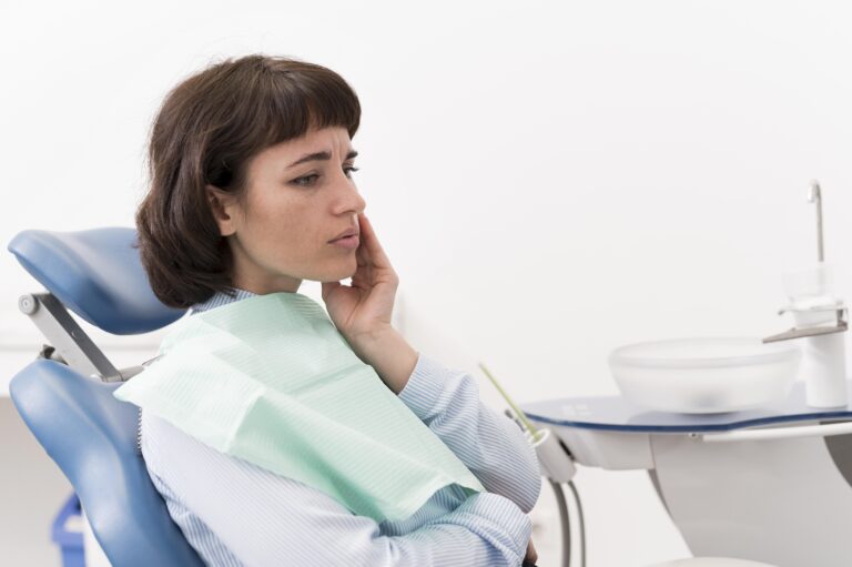 female patient having toothache dentist-s office
