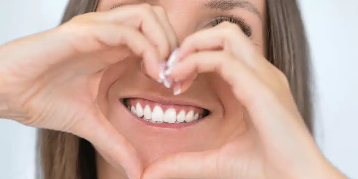 Image of a women that is showing her white teeth