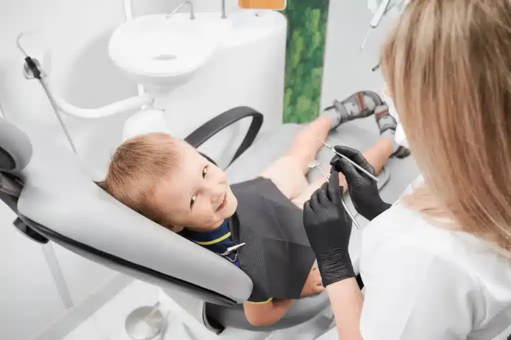 Image of a kid in a dentist clinic.