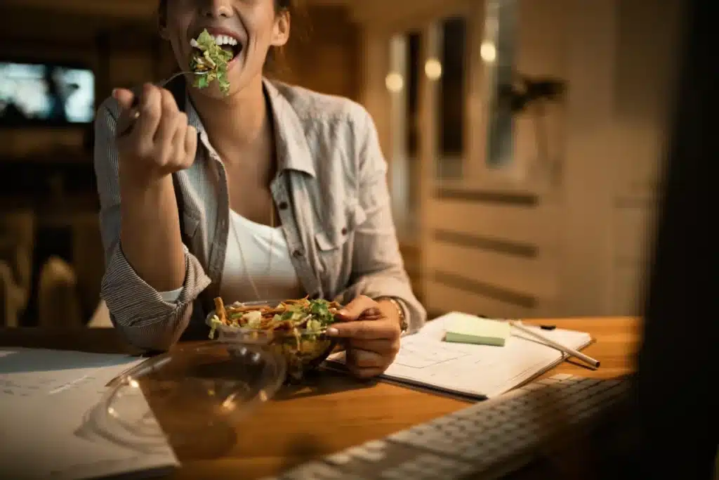 Woman eating well to avoid bad oral habits.