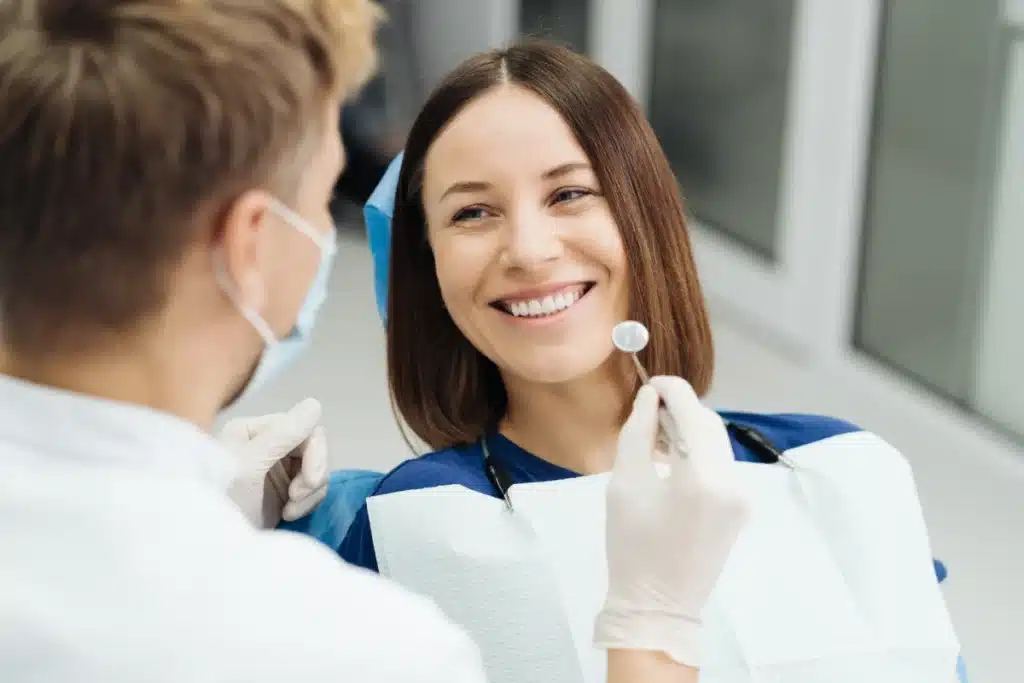 Woman at dentist getting checkup to prevent gum disease