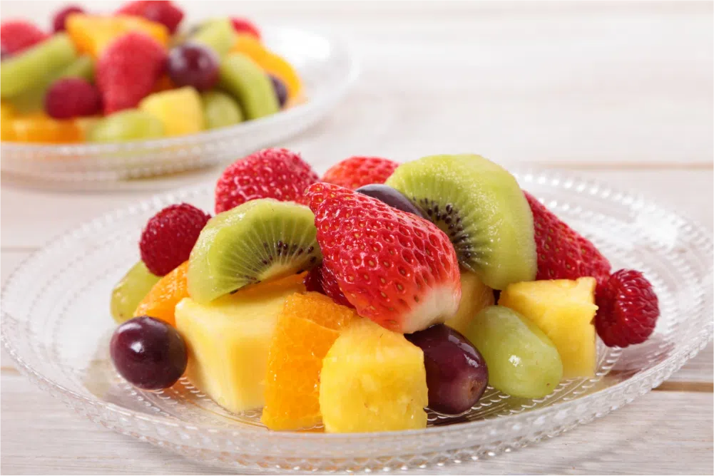 What Can You Eat with Braces? 3 Fresh mixed fruit salad plate.