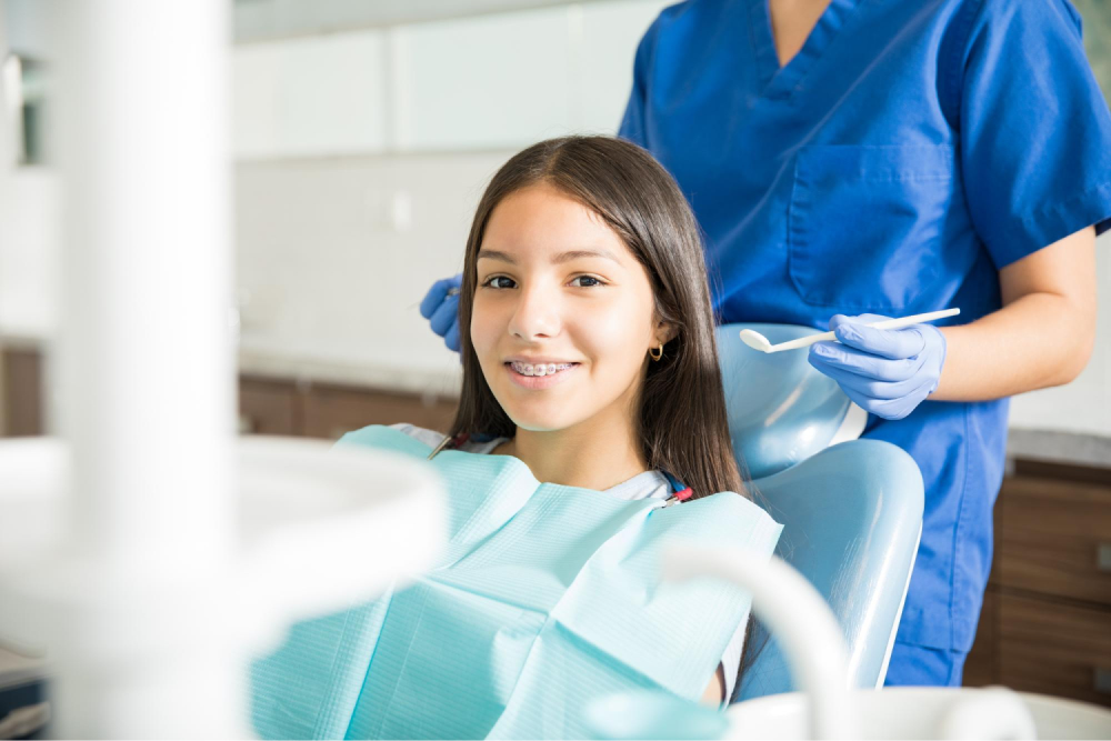 Girl smiling with dental braces.