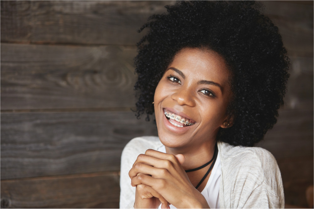 Smiling woman with dental braces.