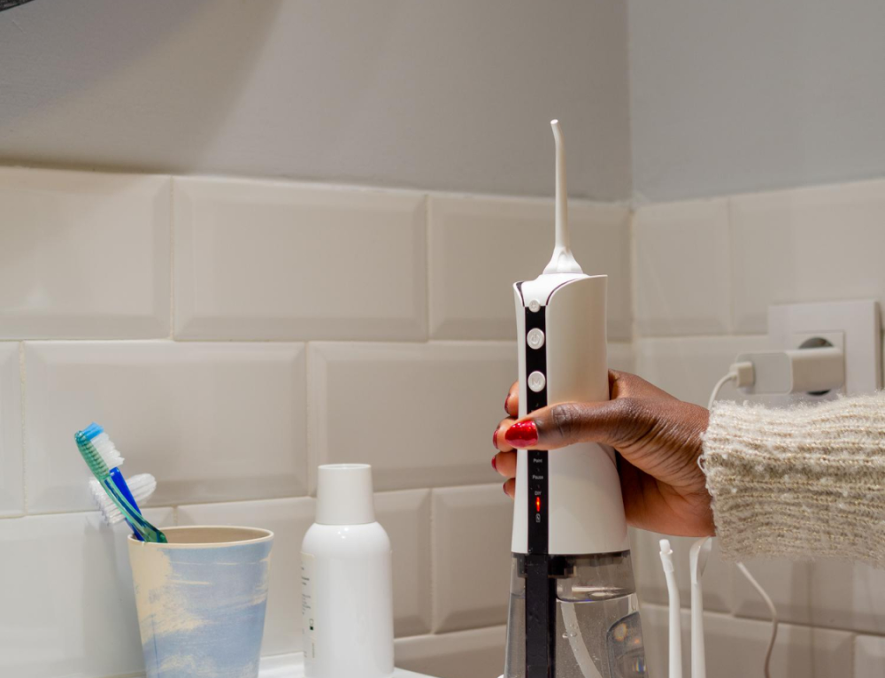 Water flosser on bathroom counter